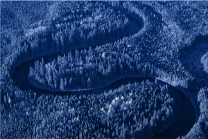 Photo of a winding river through a forest with a blue overlay